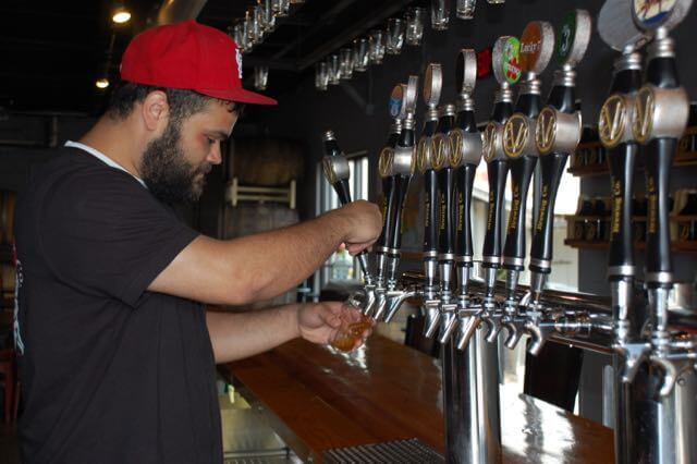 Donnie Jackson pours craft beer