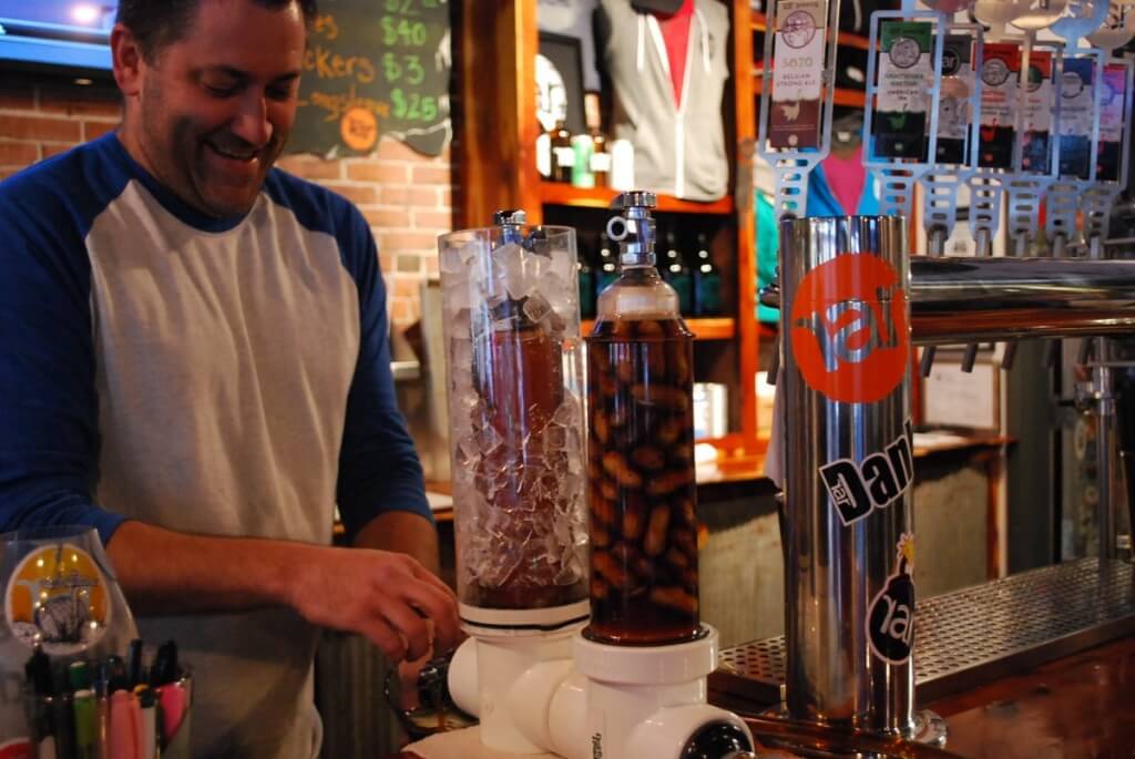 Bartender pouring beer cocktail.